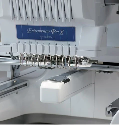 Close-up of the Brother PR1055X 10-needle system Close-up of the Brother PR1055X 10-needle system